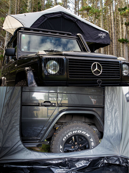 A Lucas Creek soft shell roof top tent with an annex with the rear door open to show vehicle access. 