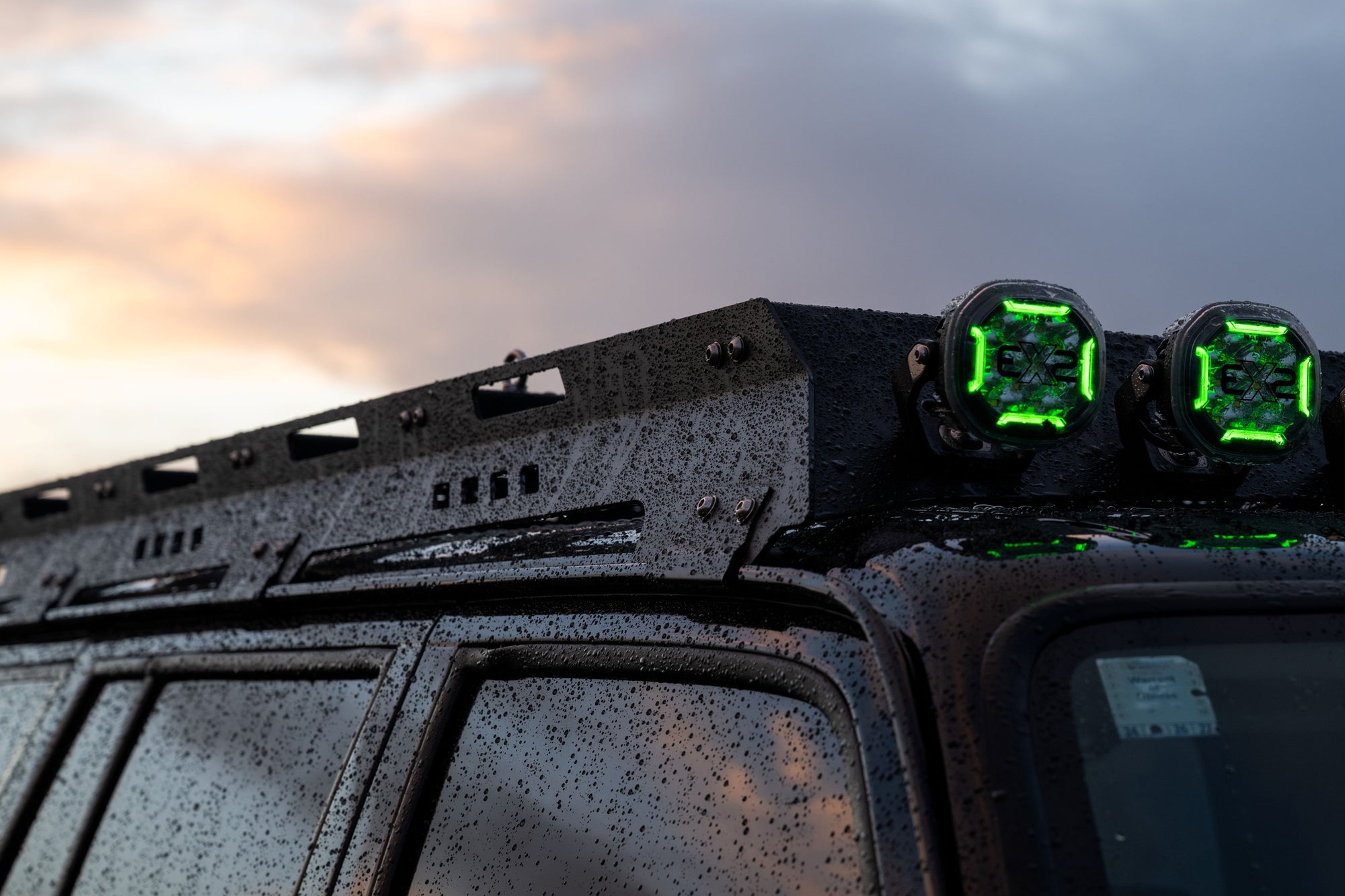 Close-up of Nissan Patrol roof rack fitted with Narva EX2 LED driving lights during an off-road build in New Zealand